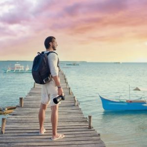 young man enjoying sunrise in Siargao