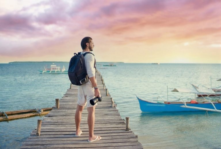 young man enjoying sunrise in Siargao